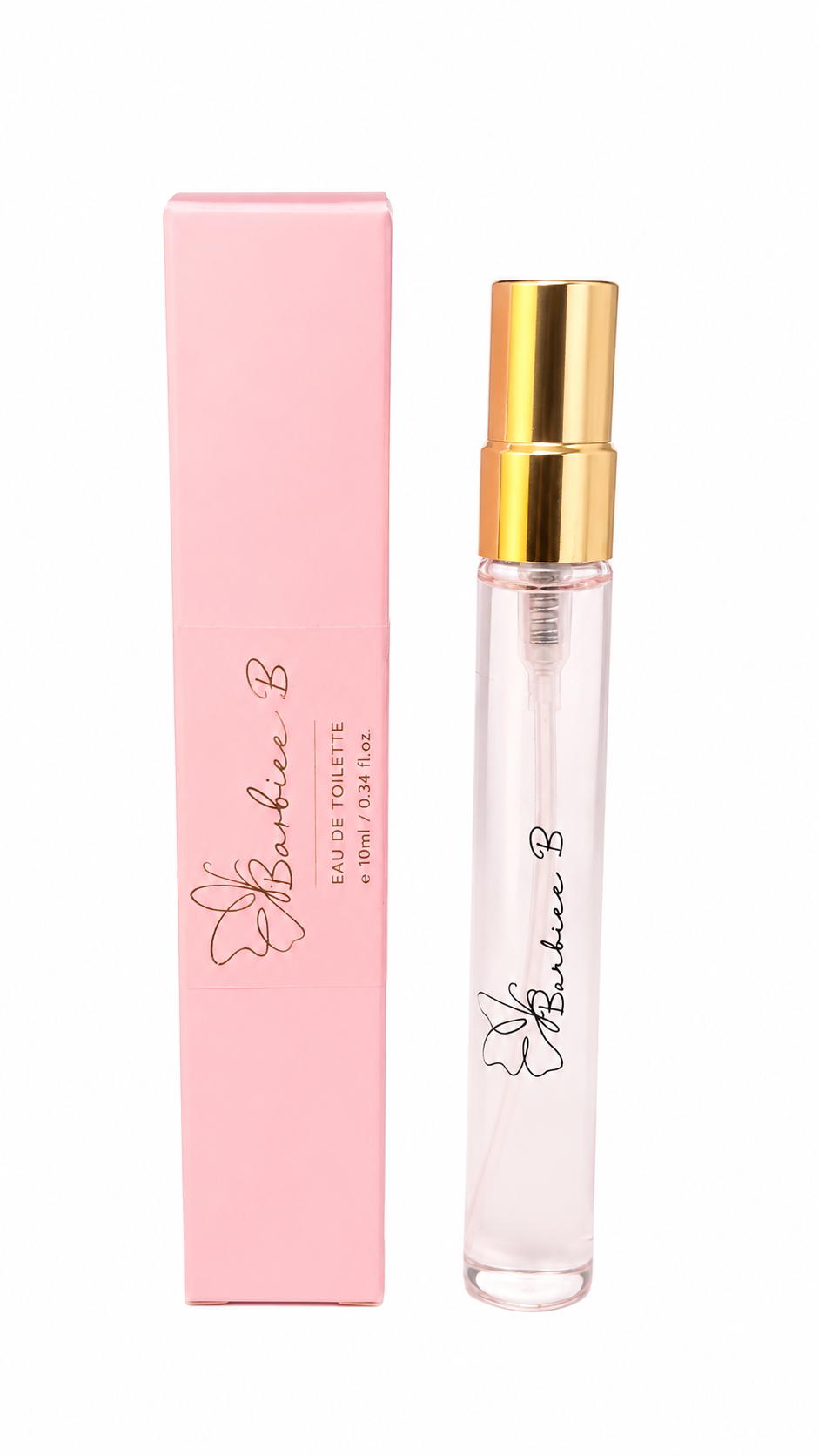 A clear glass perfume spray vial with a shiny gold atomizer cap stands next to its light pink rectangular box. Both pieces feature the 'Barbie B' logo and flower graphic printed in black and gold, set against a plain white background.